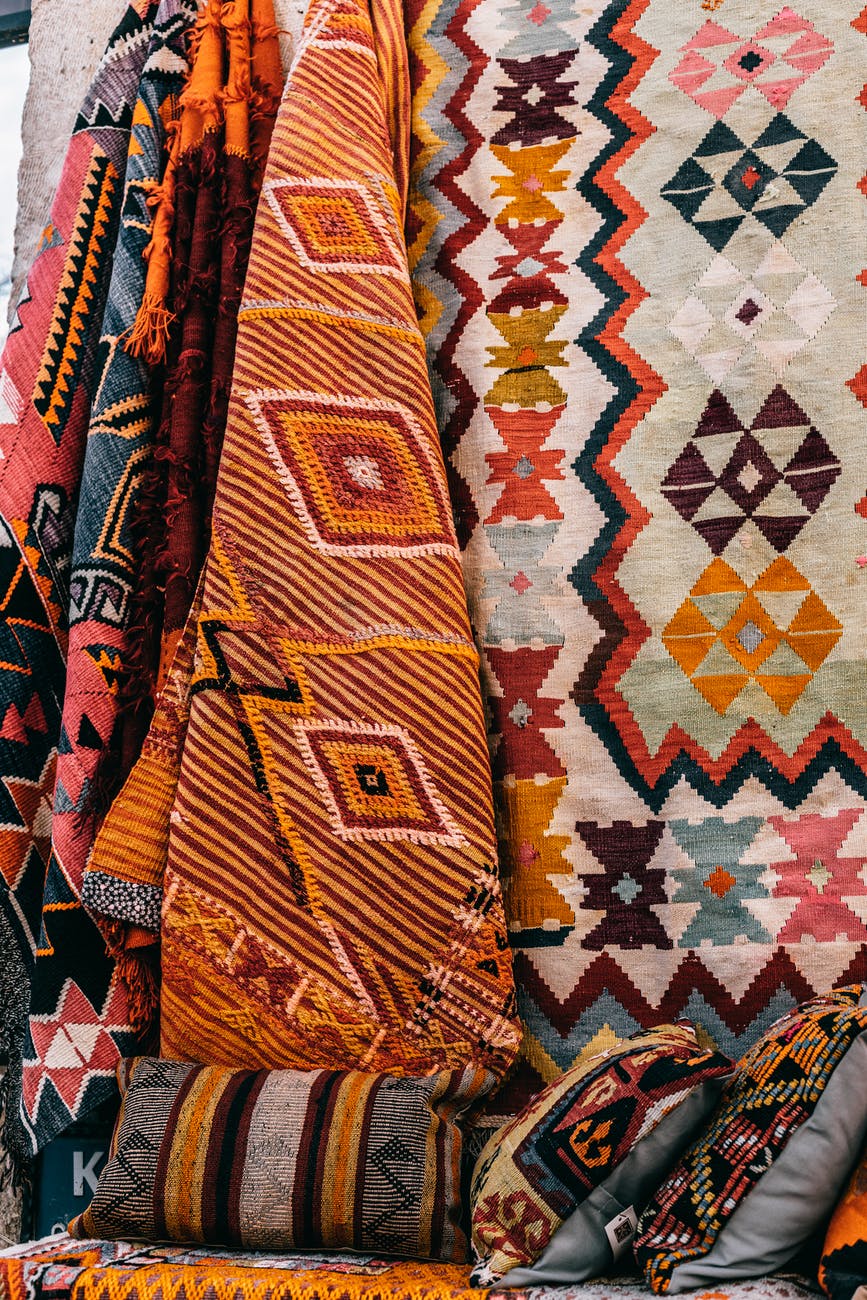 colorful carpets hanging on wall